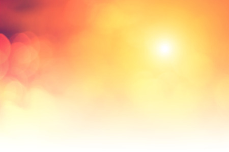 Natural background blurring.warm colors and bright sun light. bokeh background or Christmas background.Green Energy.warm sky sunny color green light patterns plain abstract flare evening clouds blurの写真素材