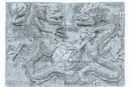 Black and white dragon brick wall texture background / Wall texture background flooring interior rock stone old pattern clean concrete grid uneven  design stack tile carve luck china grid paint taipeiの写真素材