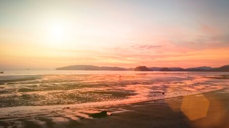 Natural background blurring.warm colors and bright sun light. bokeh background or Summer background.design, flare, sunlight, white, sunny, sky, patterns, water, beautiful, evening, clouds.の写真素材