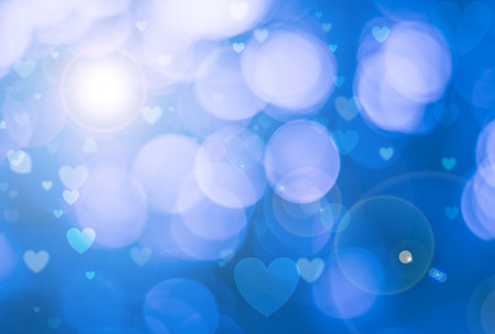 Blurred background of Valentine's day concept.  Valentines Day Card. Pastel color tones.blue white hearts wallpaper.の写真素材