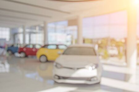 Background blur of car and showroom.Businessmen blur in the workplace.abstract blur background work in office with car.Abstract background of office. shallow depth of focus.auto motor sale shop colorの写真素材