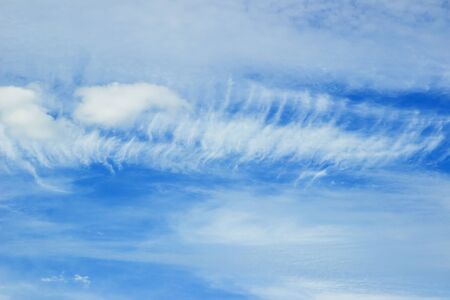 white fluffy clouds in the blue sky abstract background.