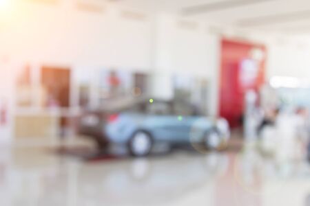 Blur the background of the car and Showroom at blurred in workplace or abstract background of shallow office depth of focus.の写真素材