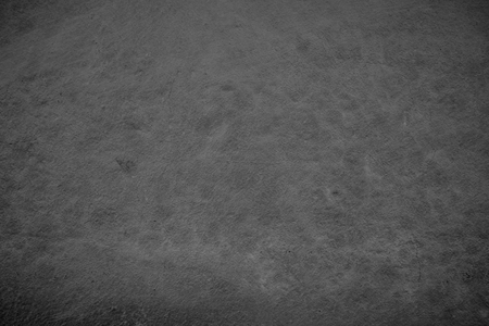 Art concrete or stone texture for background in black, grey and black colors. Cement and sand wall of tone vintage.の写真素材