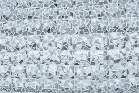 Broken tiles mosaic seamless pattern. White or Gray tile real wall high resolution real photo or brick seamless with texture interior background. Abstract wallpaper irregular in bathroom.の写真素材