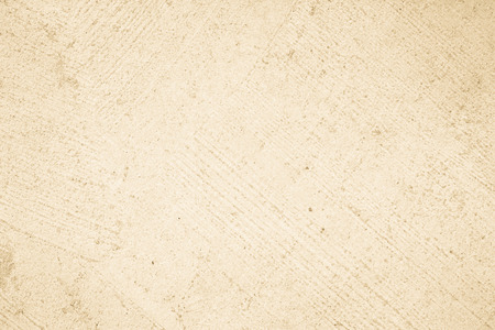 Cream concreted wall for interiors or outdoor exposed surface polished concrete. Cement have sand and stone of tone vintage, natural patterns old antique, design art work floor texture background.の写真素材