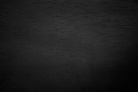 Abstract vignette black wood texture high quality close up. Dark furniture plank material wallpaper. Blank grunge wooden grain surface be used design as background or board luxury floor copy space.の写真素材