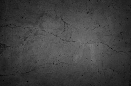 Art black concrete stone texture for background in black. Abstract color dry scratched surface wall cover colorful paper scratches shabby vintage Cement and sand grey dark detail covering.の写真素材