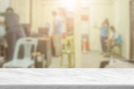 White stone marble table top and blurred abstract background from interior building banner backdrop...