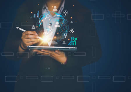 Business using tablet smartphone doing online transactions Internet technology. Global data...