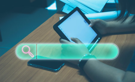 Data search technology, computer search optimization, women's hand using tablet to searching for...