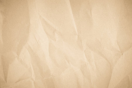 Brown recycled kraft paper crumpled vintage texture background for letter. Abstract parchment old retro page grunge blank newspaper. Cream pattern rough crease grunge surface.の写真素材