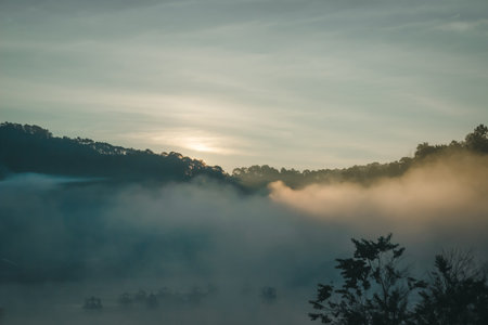 Natural fog and mountains sunlight background blurring, misty waves warm colors and bright sun...