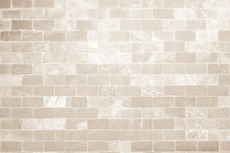 Cream and white brick wall texture background. Brickwork and stonework flooring backdrop interior design home style vintage old pattern clean with concrete uneven color beige brickの写真素材