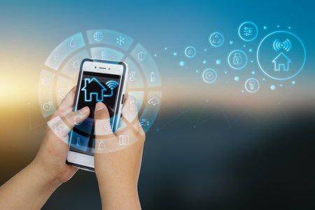 Smartphone remote control system for modern residences with technology for the convenience and safety of service users. Remote control and home management. Home automations future.の写真素材
