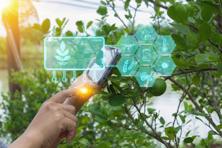 Ai smart farming agriculture concept. Holding smartphone monitor, track agricultural produce through modern wireless network. Smart farming innovation, future 5G technology analyzeの写真素材