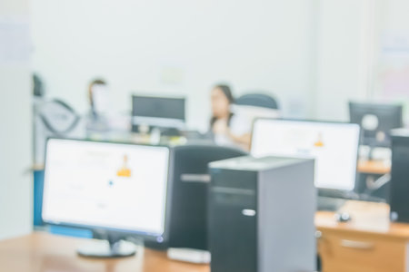 Business woman blur in the workplace at sitting with desk computer screen work space of table in...