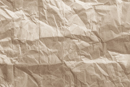 Brown crumpled paper texture or background for design with copy space for text.の写真素材