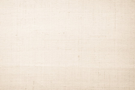 Brown sackcloth woven texture background in natural pattern. Jute hessian burlap, linen background in light beige cream color blank.の写真素材