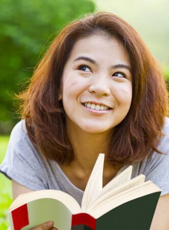 Young woman reading bookの写真素材