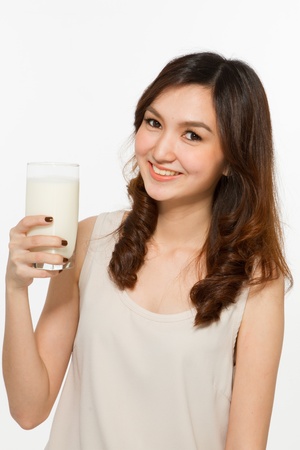Young woman drinking milk の写真素材