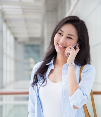 Young woman talking on the phoneの写真素材