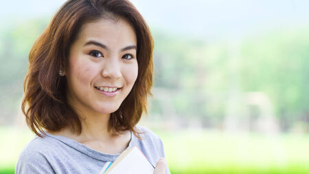 Asian student in the parkの写真素材