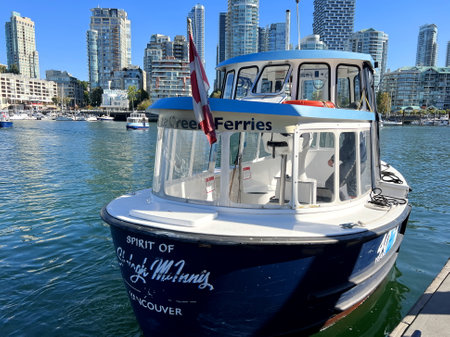 Granville Island Ferry boat docked along in Granville island near Burrard Street Bridge at twilight in Vancouver Canadaのeditorial素材