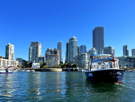 Granville Island Ferry boat docked along in Granville island near Burrard Street Bridge at twilight in Vancouver Canadaのeditorial素材