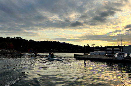 A rowing lesson on the water Teenagers are engaged in sports club They are learning rowing Boathouse rowing sailing paddling center city of port moody Esplanade Ave Rocky Point Park Recreational Pierのeditorial素材