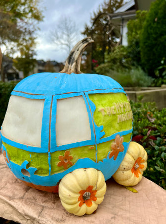 art carving of vegetables Cinderellas carriage is made of pumpkins and painted blue Carved different characters and faces on a pumpkin Halloween decorations for autumn harvest festivalsのeditorial素材