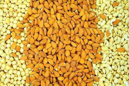 Beautiful delicious background Mixture of nuts on a plate almond cashew hazelnut three types of nuts...