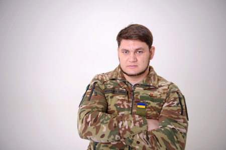 blue eyes masculine chin beard neat stern look ZSU badge and flag of ukraine patch on uniform...