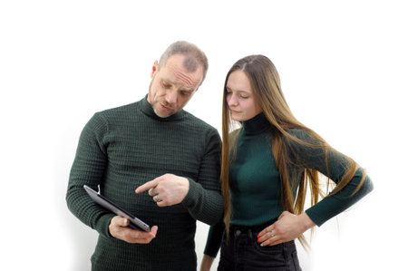 buyer indicates technical characteristics of gadget to seller guy girl choose laptop in hardware store at computer science lesson artists designers examine sketch in art editor gadget for designersの写真素材