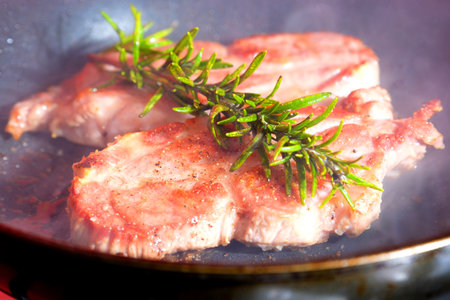 Beef steaks on the grill with flames grilled beef steaks with spices isolated Juicy steak medium rare beef with spicesの写真素材