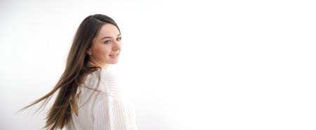 Closeup portrait of beauty woman with fair perfect healthy lift glow skin hand touching chin neck isolated on white, beautiful girl with pretty smile face. Beauty spa skincare bannerの写真素材