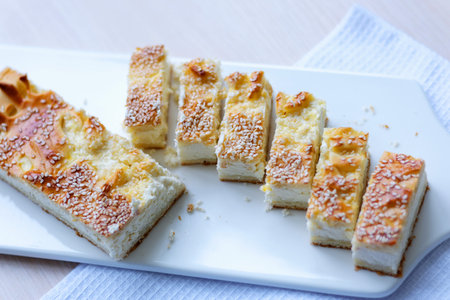 Traditional Ukrainian pies with eggs, green onion, sorrel on dark background. Russian piroshki, homemade baked patties.の写真素材
