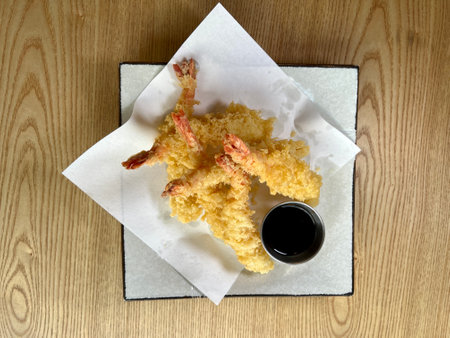 vietnamese cuisine, a plate of white tempura shrimp in batter on a lettuce leaf, on a white isolated background, topの写真素材