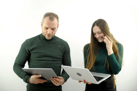 two investors analyzing about stock market and cryptocurrency investment from graph in computer laptopの写真素材