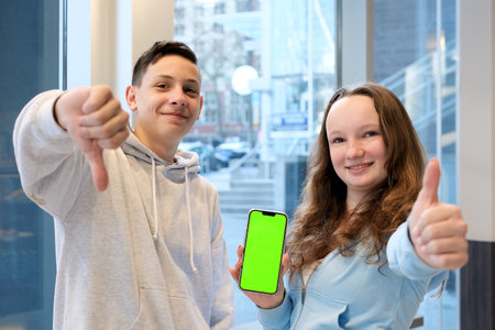 emotions boy holding thumbs down girl holding thumbs up Like it or dislike Green chroma key...