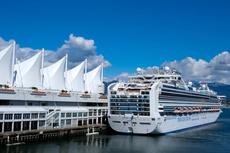 Canada Place beautiful screensaver of any background For text of advertising Vancouver travel cruise liners sea bass sea bus huge ship Helicopter runway white snowy fluffy cloudsのeditorial素材