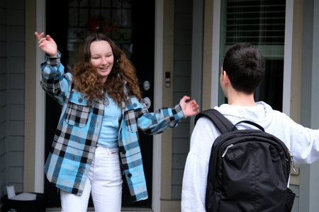 high school students friends high school teenagers see off girl home first date crush relationship first love look tenderly at each other school years private quarter canada vancouver americaの写真素材