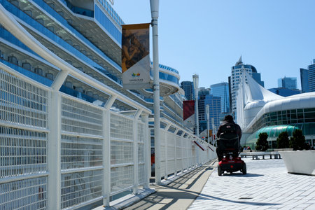slow motion video filming blue sky Pacific Ocean large cruise liner stands off coast of Canada Place...