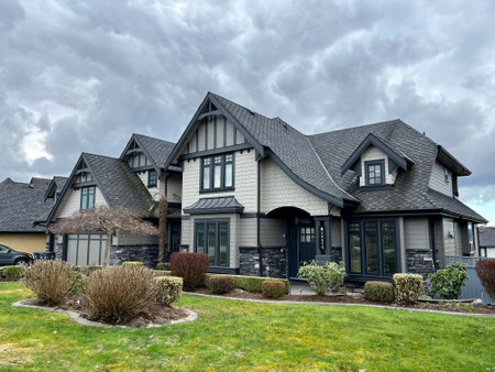 beautiful new house in city of Surrey near Vancouver Canada private sector no people clouds picture like from visualization magazine desire to have such mansion street trees built two-story cottageのeditorial素材