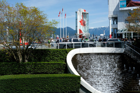 Canada Place and commercial buildings in Downtown Vancouver Viewed from water during sunset. British Columbia, Canada.のeditorial素材