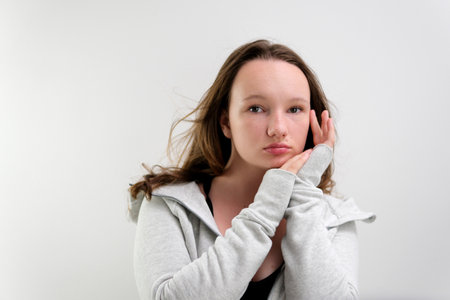 thinking girl put hand to chin and does not understand the situation thinks rolled her eyes upward...