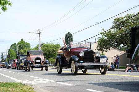 Cloverdale on bright sunny day gay parade processions fun people expect celebrate waving ride in cars brightly decorated with sexual revolution in Canada in schools and on streets freedom of choiceのeditorial素材