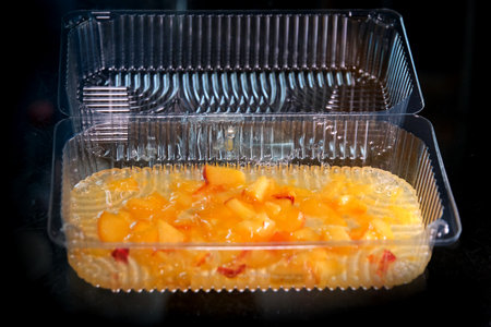 Homemade peach jam with organic fruit. Sweet preserves on a light backgroundの写真素材