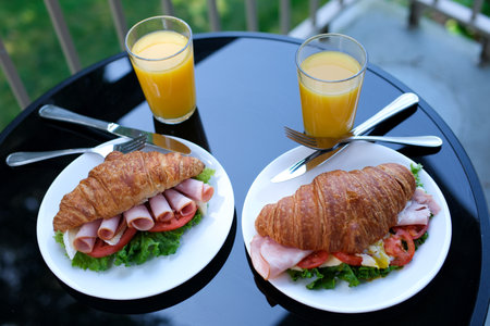six pieces of bacon rolled into a sandwich croissant Lettuce leaves Brie cheese breakfast chic food...