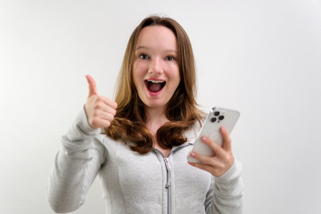 Young happy fun secretary employee business woman in casual shirt work stand at white office desk...
